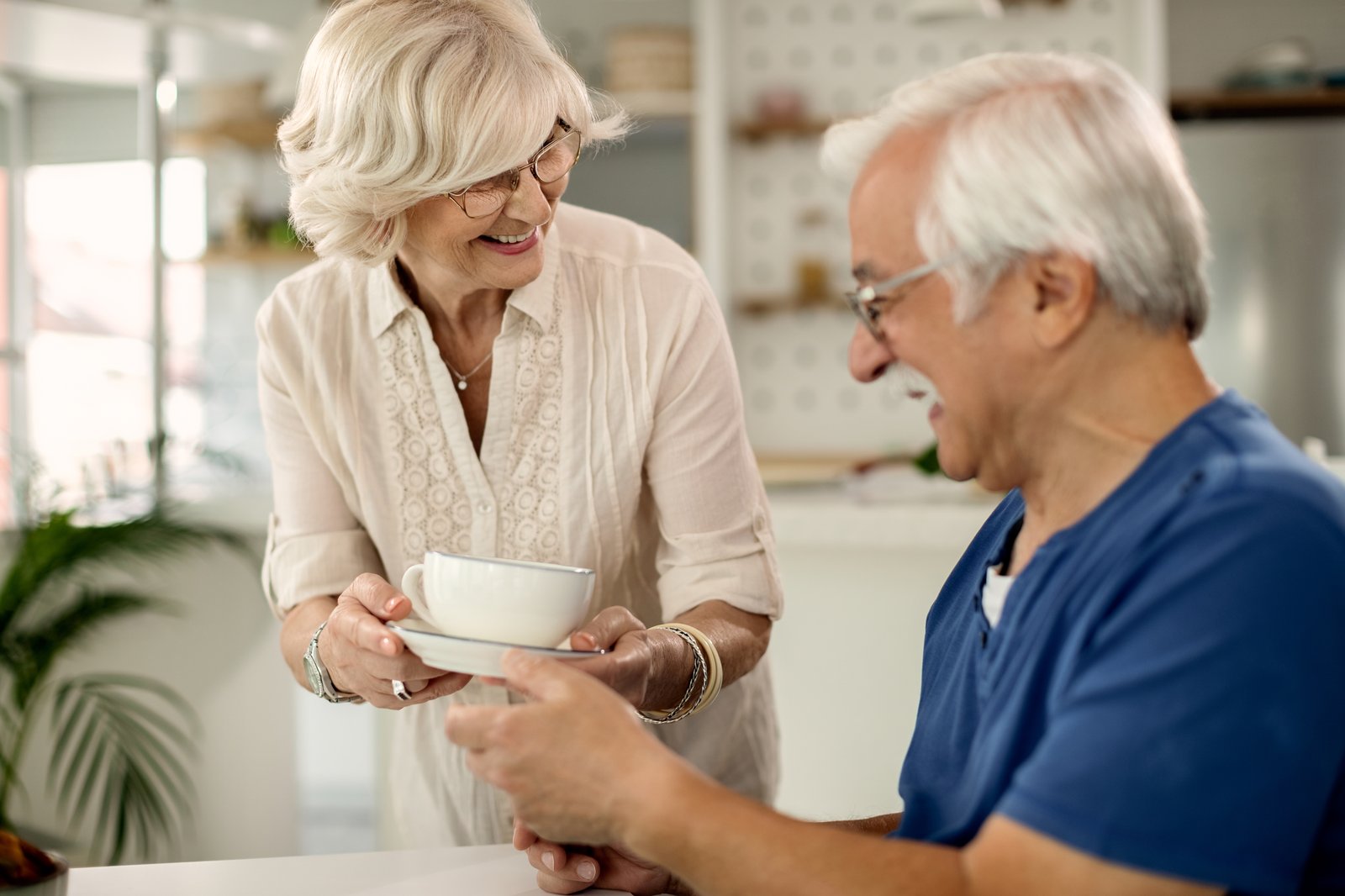 A couple sharing coffee at home